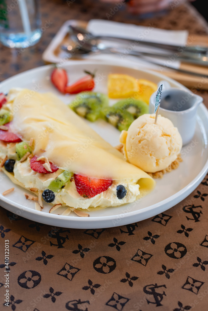 Cold crepes, vanilla ice cream with crepes and strawberry, sweet and desserts Cold crepes, vanilla ice cream with crepes and strawberry, sweet and desserts