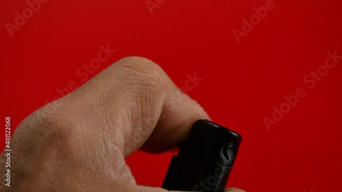 close up of hand lighting a lighter, smoking photo