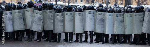 Photography Line of police riot forces, protest in city