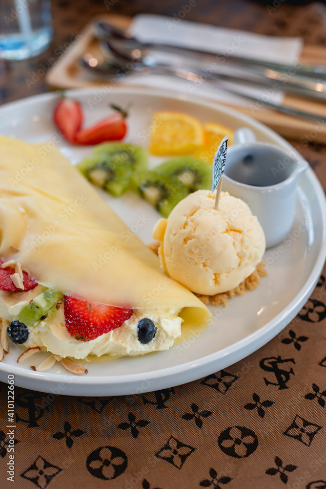 Cold crepes, vanilla ice cream with crepes and strawberry, sweet and desserts Cold crepes, vanilla ice cream with crepes and strawberry, sweet and desserts