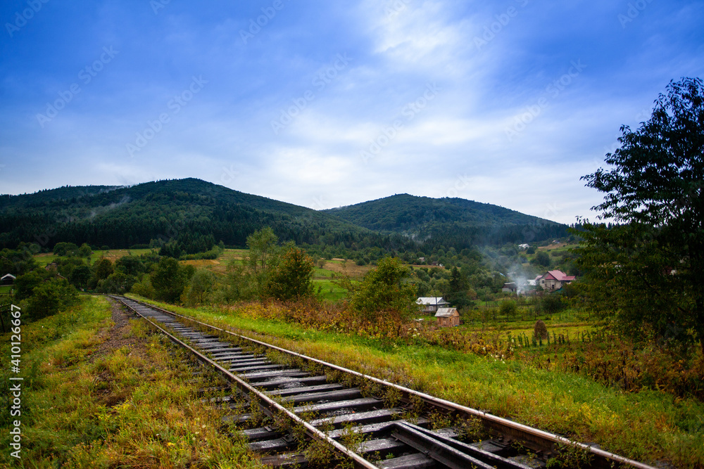 Railway in the mountains scenic views tourist route green landscape fluffy forest settlements Carpathians Railway in the mountains scenic views tourist route green landscape fluffy forest settlements Carpathians
