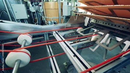 Production line with waffles. Mechanical conveyor is displacing waffle layers photo