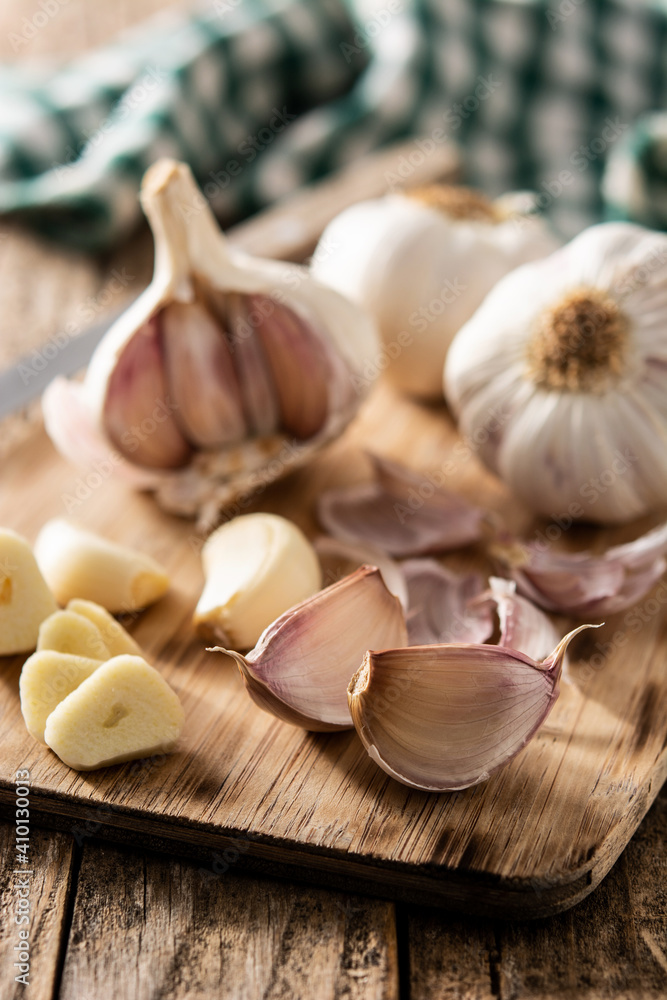 Garlic cloves on rustic wooden table