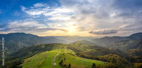 Fototapeta Naklejka Na Ścianę i Meble -  Beautiful landscape in the mountains at sunrise. Sun light and mountain sky