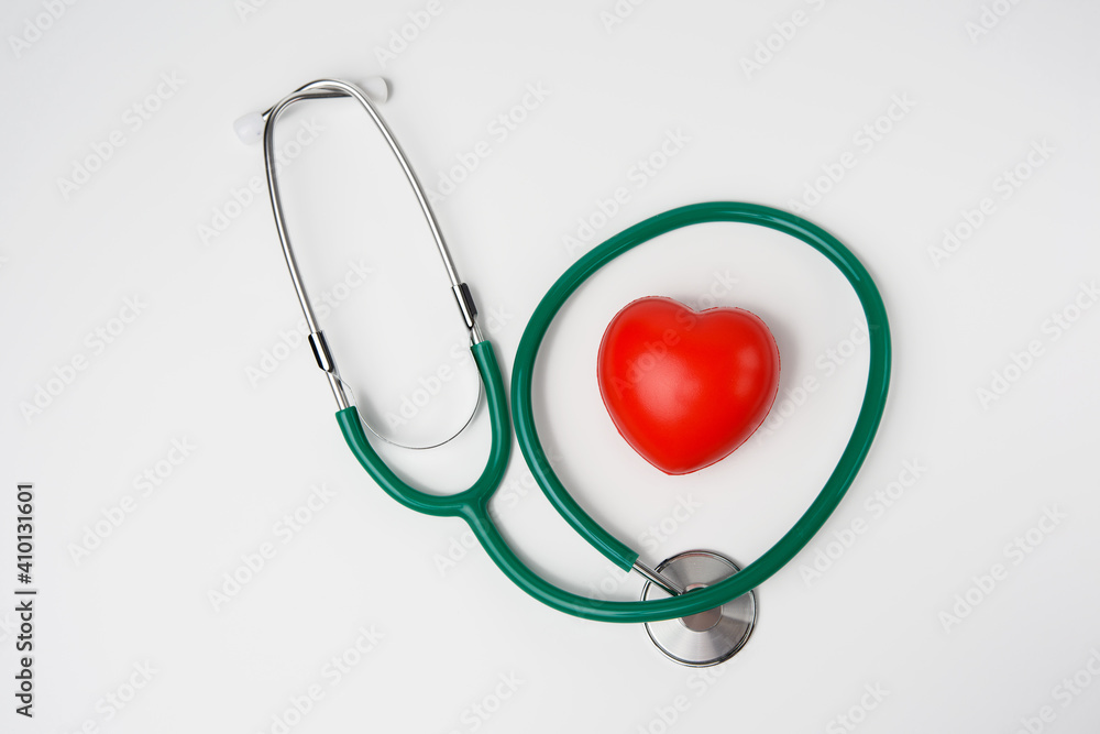 medical stethoscope and red rubber heart on white background medical stethoscope and red rubber heart on white background