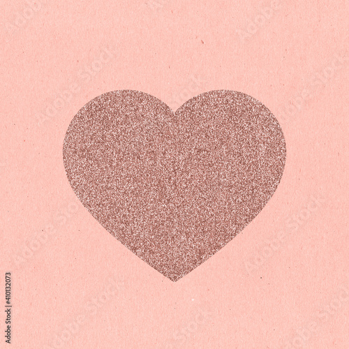 Heart of pink sequins on pink craft cardboard. Card for Valentine's Day. Pink sequins.