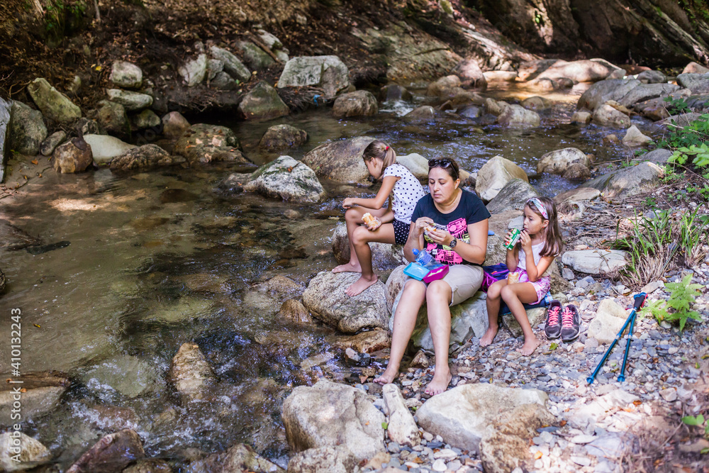 Family Enjoy Nature Walking By Mountain Creek, Hiking Adventure, Active People, Forest Stream, Summer Season
