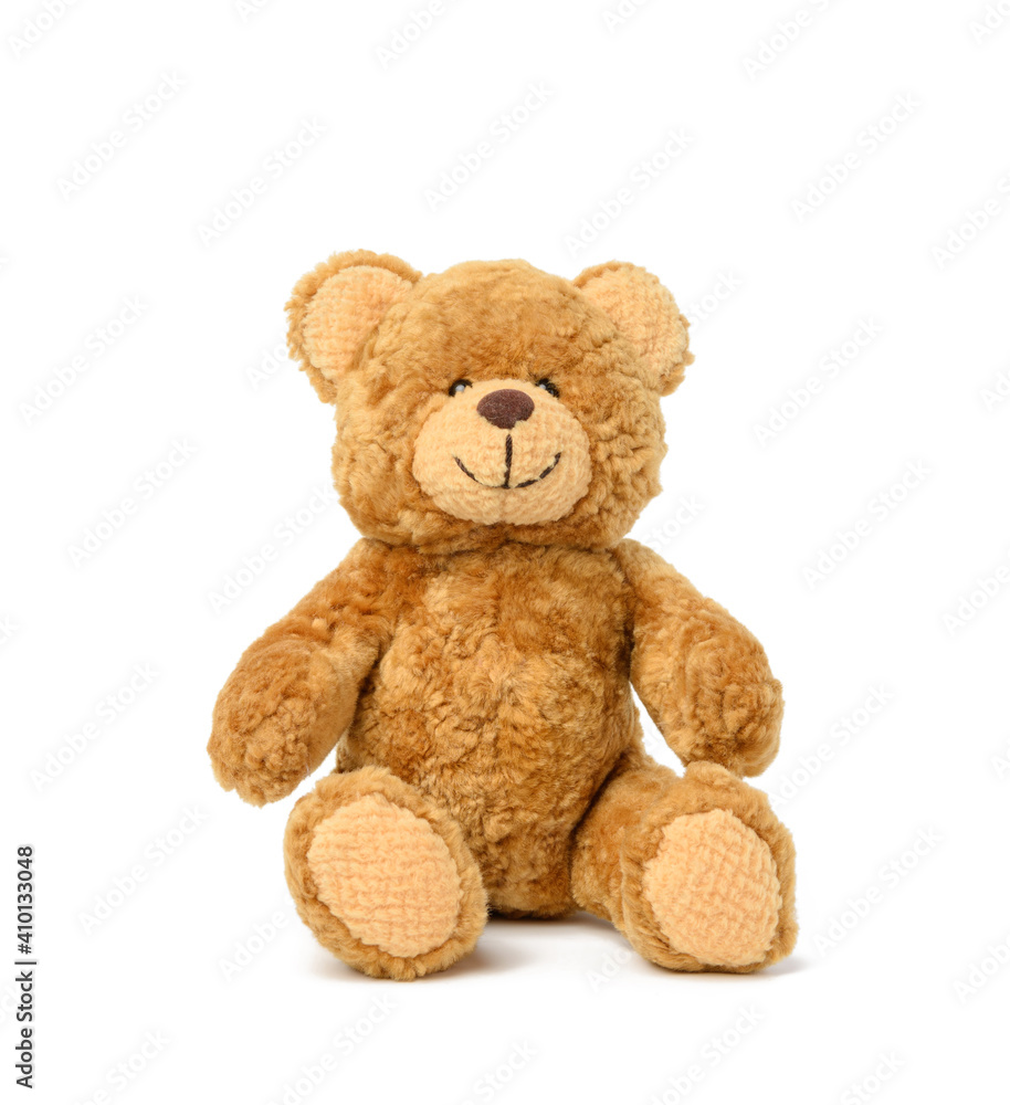 brown teddy bear sits on a white background