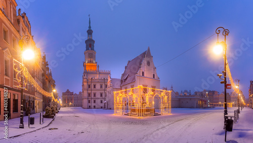 Panorama of Poznan Town Hall and Christmas tree at Old Market Square in Old Town in the snowy night, Poznan, Poland
