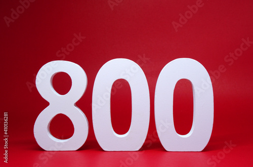 Number 800 ( Eight hundred ) Isolated red  Background with Copy Space -  800% Percentage or Promotion - Discount or anniversary subscribe concept 