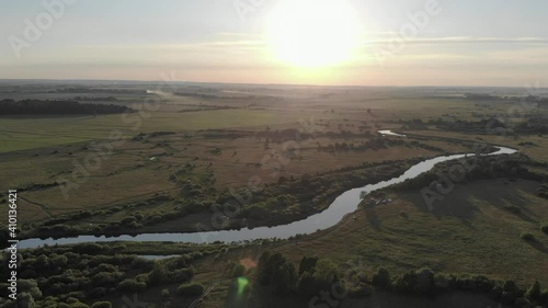 Beautiful panorama of the forest field river sunset