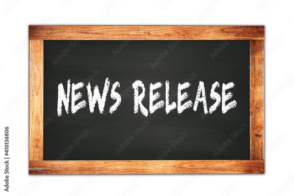 NEWS RELEASE text written on wooden frame school blackboard. NEWS RELEASE text written on wooden frame school blackboard.