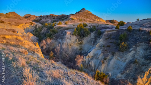 Geological stony-clay landscape  mountains and rocks in the evening at sunset. North Dakota