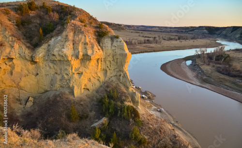 View of the winding river from the mountain in the evening at sunset. North Dakota