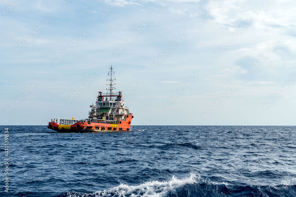 An offshore anchor handling tug boat in operation at oil field