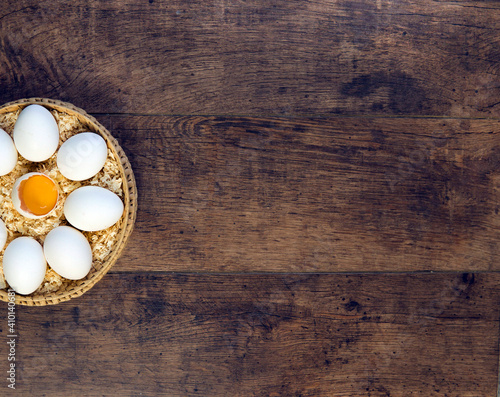 The eggs. Egg yolk. Broken egg on a wooden background. Egg tray.