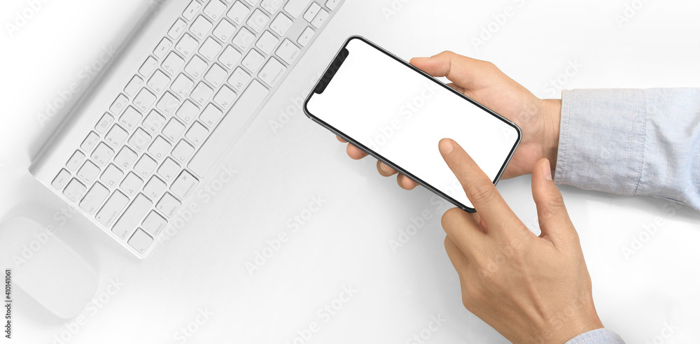 Hand holding smartphone device touching screen Hand holding smartphone device touching screen
