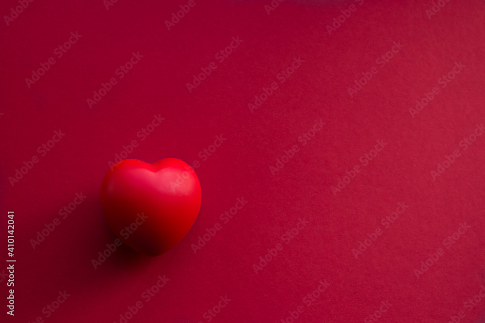 Red volumetric heart on a red background horizontal photo with place for text Red volumetric heart on a red background horizontal photo with place for text