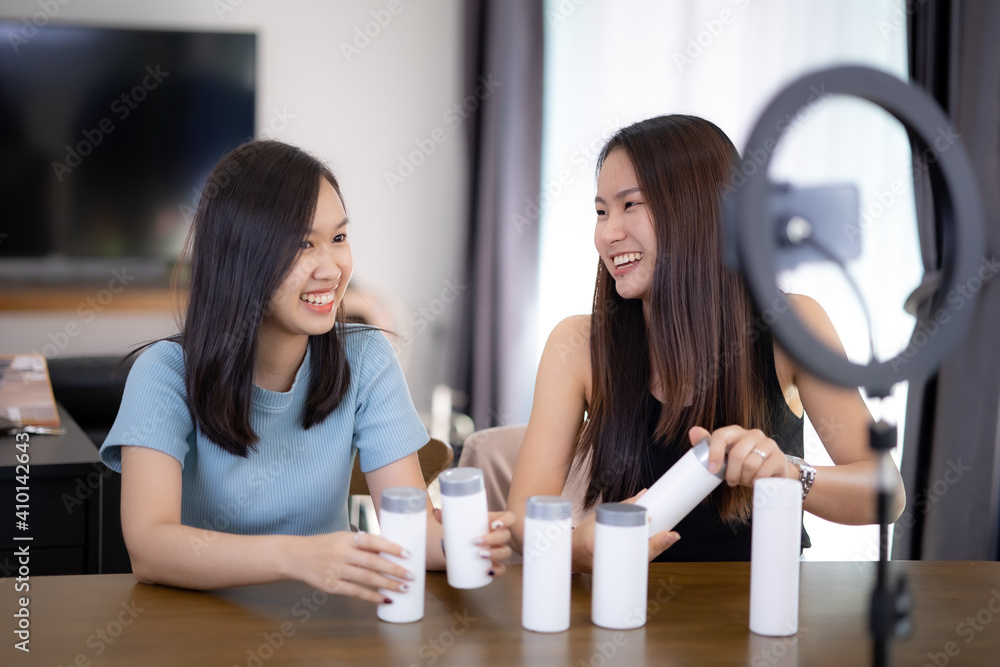 Two young Asia women live streaming sale online