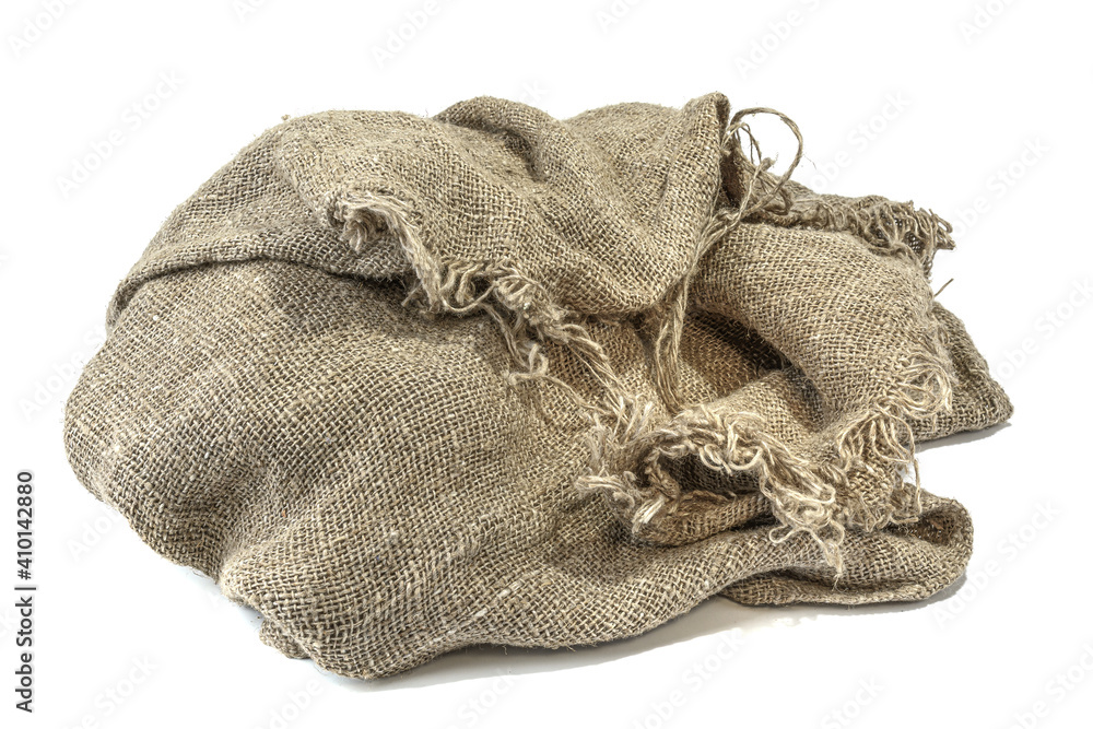 Fototapeta premium An empty old crumpled burlap bag, isolated on a white background.