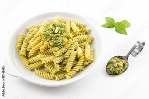 Pasta with pesto, basil leaves with white background