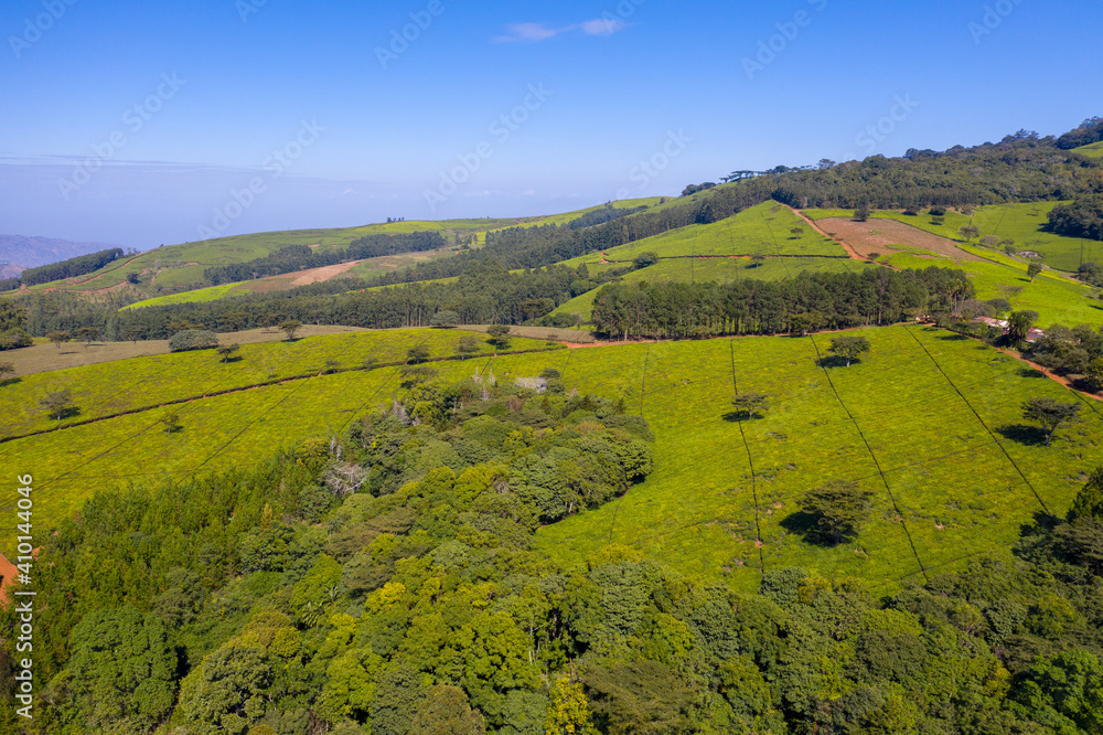 Panoramic aerial view of a tea estate in Malawi with the Shire River Valley in the far distance.