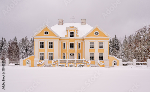 old manor in winter time, europe, estonia photo