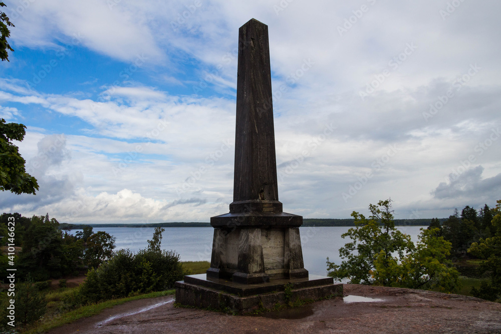 Obraz premium old stone stele in the park