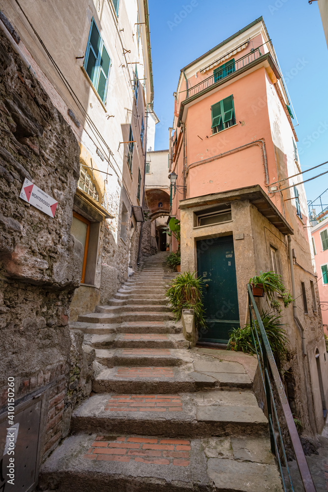 Walking narrow streets of Vernazza village in Cinque Terre on the Italian Riviera