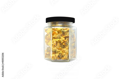 Dried chrysanthemum in a bottle on white