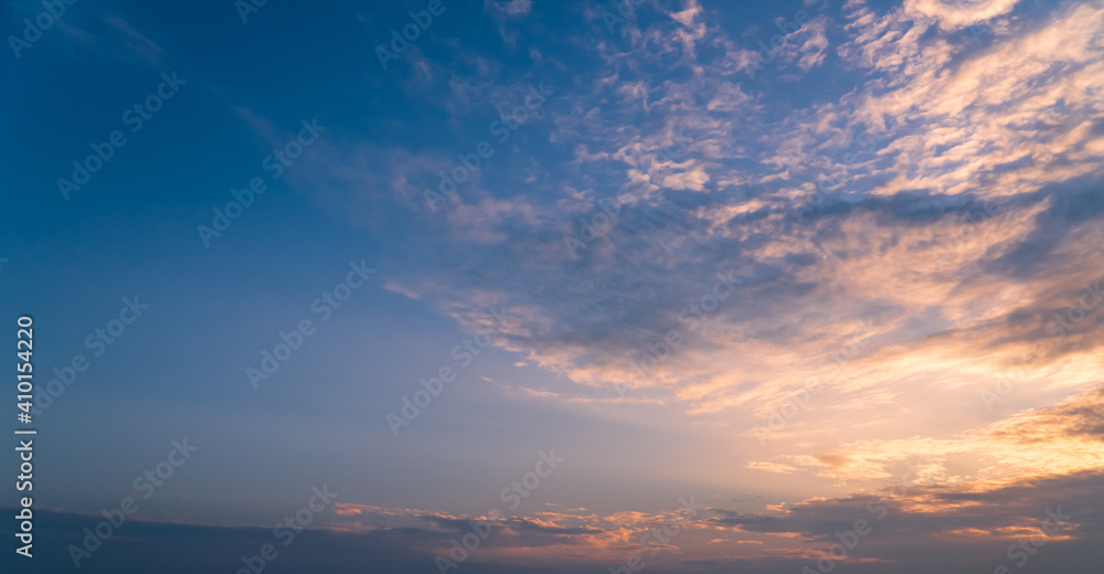 sunset sky in the morning with colorful orange sunrise cloud and blue background  