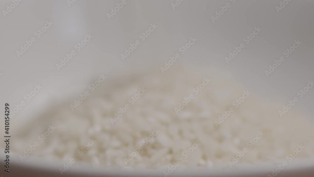 Close up shot of rice filling a bowl Close up shot of rice filling a bowl