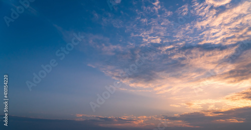 sunset sky in the morning with colorful orange sunrise cloud and blue background 