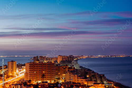 Beautiful view of Mar Menor sea and the Mediterranean Sea at night in San Javier, Murcia, Spain photo