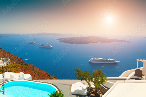 White architecture and blue sea on Santorini island, Greece. Luxury swimming pool with sea view. Famous travel destination