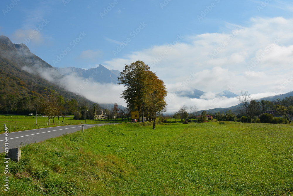 Low clouds in the autumn landscape along the road leading from the Italian border to Kobarid in the Slovene Littoral or Primorska region of western Slovenia
