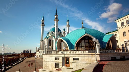 Crowd of tourists walk along square near Kul Sharif mosque photo