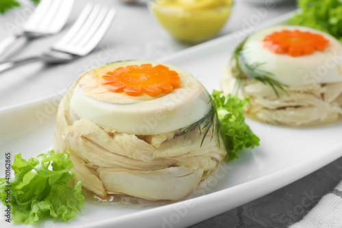 Bild auf Leinwand Delicious chicken aspic with eggs and vegetables on plate, closeup