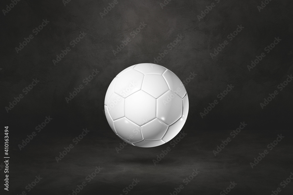 White soccer ball on a black studio background