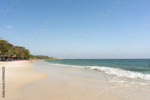 Beach and waves tropical sea with blue sky on sunny day background. copy space