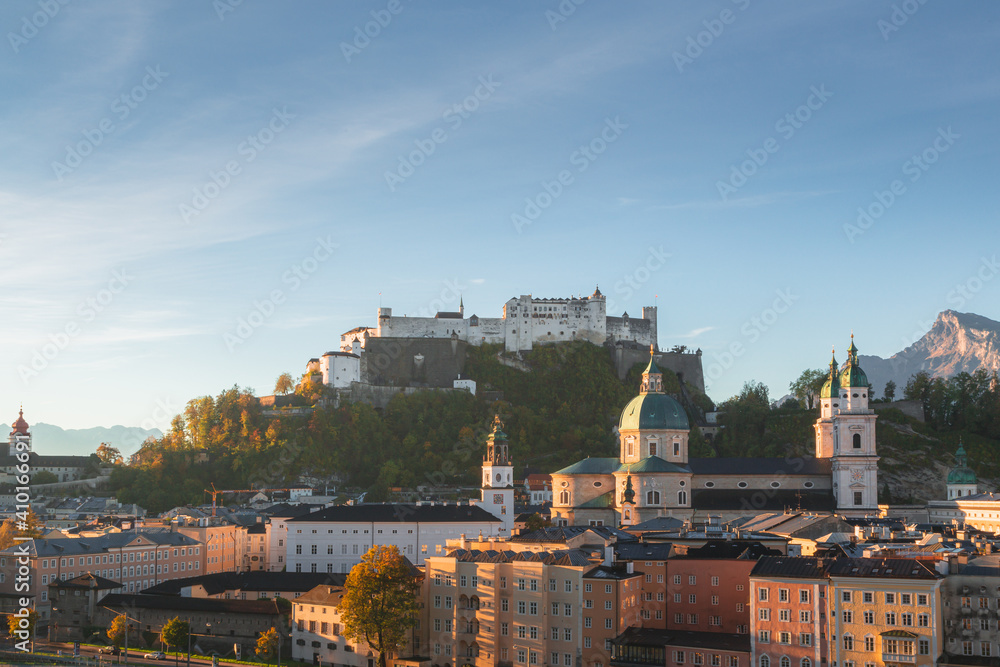 Sunrise old town view of Salzburg city, Austria with Fortress Hohensalzburg and UNESCO site Kollegienkirche (church of the University of Salzburg).