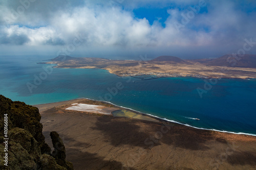 Graciosa island and El Rio canal from the El Rio lookout in Lanzarote, Canary Islands, Spain photo