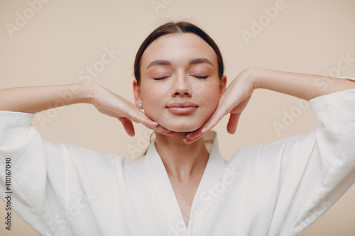 Stampa su tela Young woman doing face building yoga facial gymnastics self massage and rejuvena
