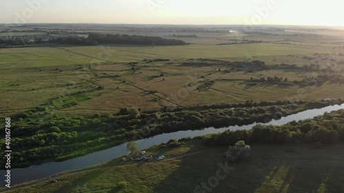 Beautiful panorama of the forest field river sunset
