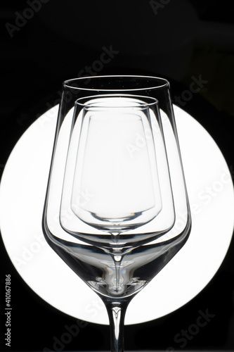Empty glasses on black and white 
