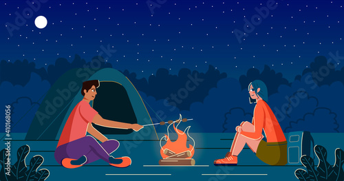 Man and woman on a campsite with a campfire and a tent. Man frying marshmallows on the wooden stick.