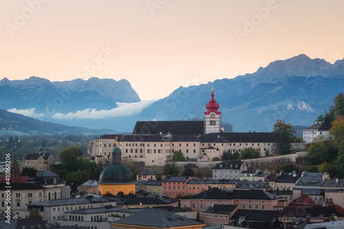 Sunrise view of Stift Nonnberg Benedictine Monastery and the city of Salzburg, Austria with the Eastern Bavarian Alps. photo