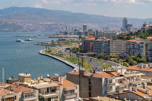 Izmir, Turkey. June 6, 2019: Landscape with aegean sea, buildings and highway. Blue sky and mountains. photo
