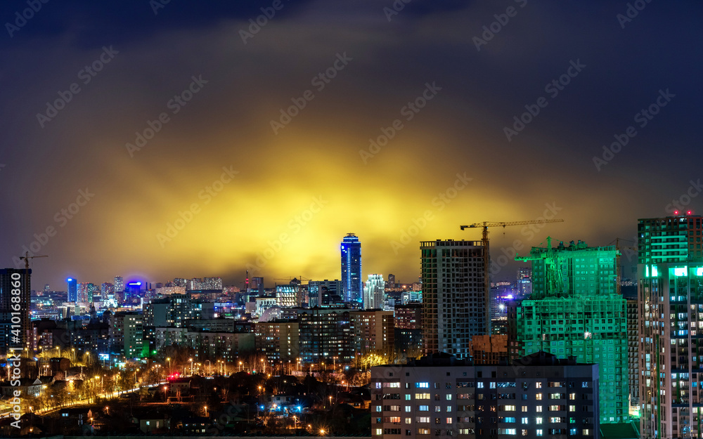 Vysotsky building in Yekaterinburg on the background of storm clouds at night 2