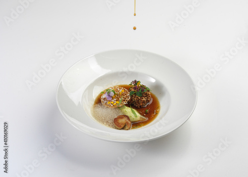 michelin star chef is decorating conceptual cuisine plate 